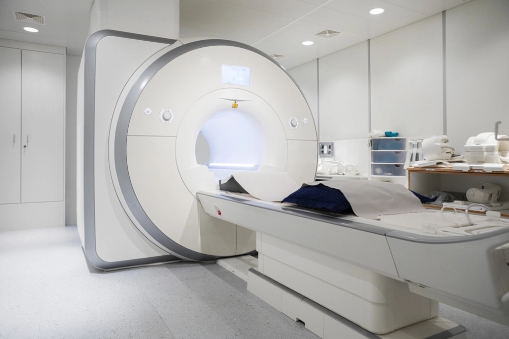 Empty MRI Scan Machine In A Clean White Room